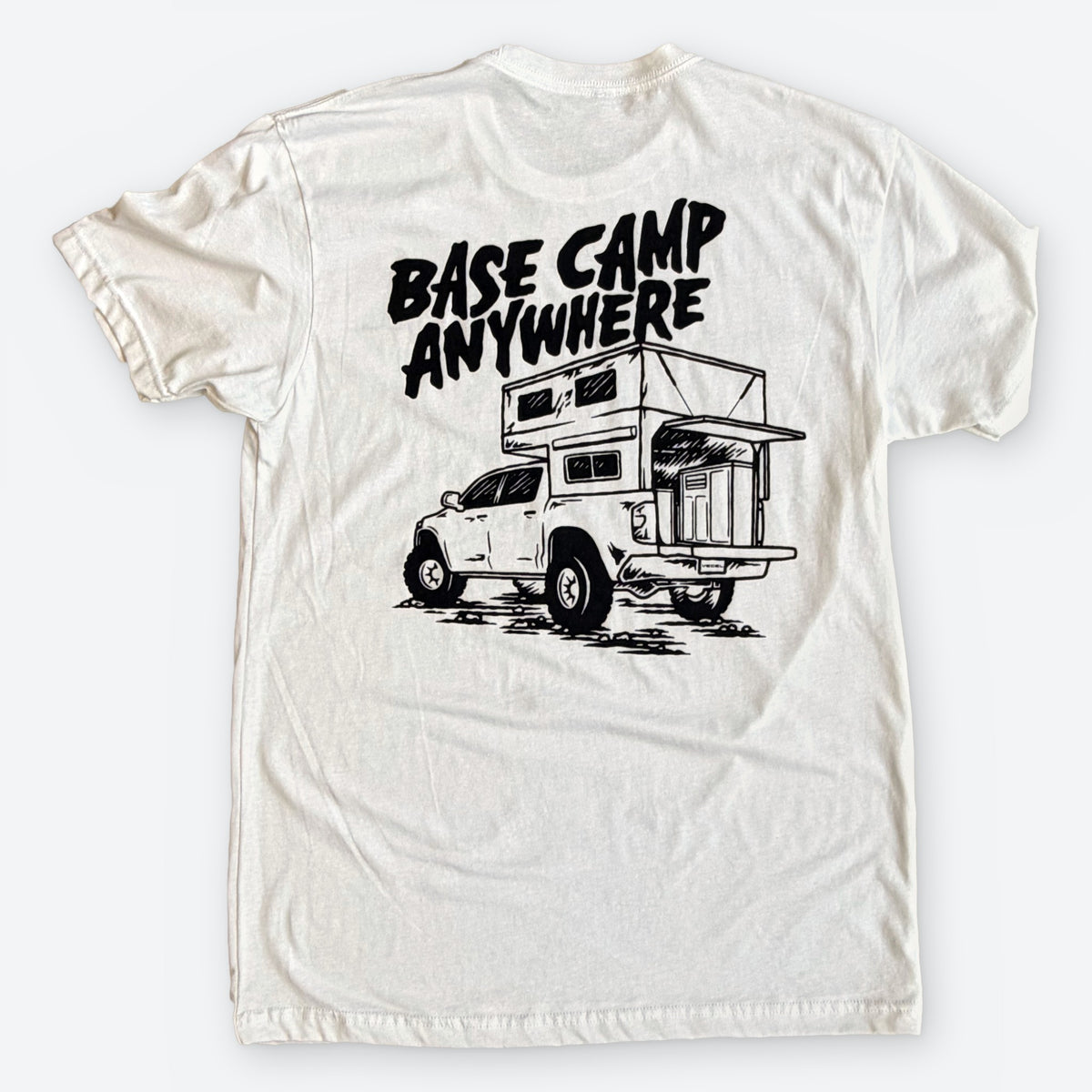 Adventure Rig tee in white, back with Base Camp Anywhere truck camper illustration